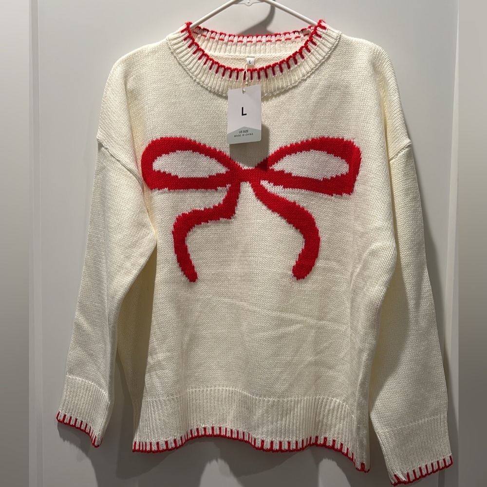 Women's Cream Sweater with Red Bow Design